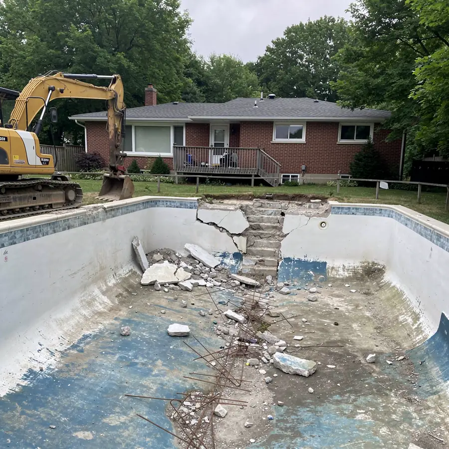 Breaking concrete pool walls in Guelph backyard