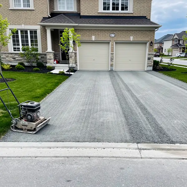 Compacted driveway base ready for asphalt paving