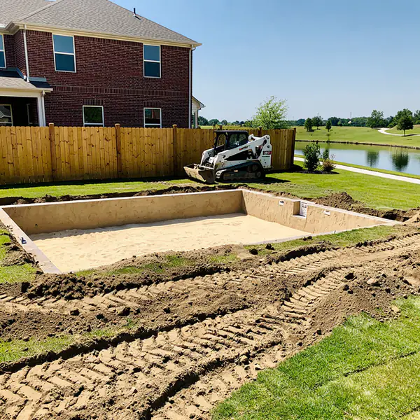 Excavated pool hole in Waterloo backyard
