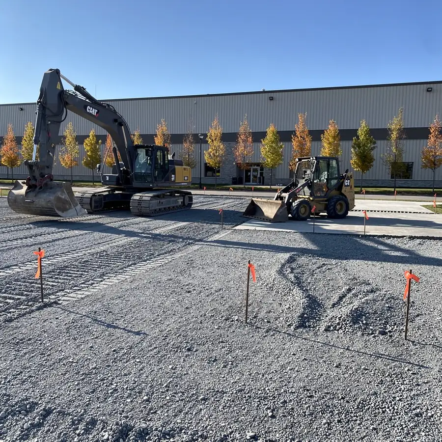 Excavator grading commercial building pad in Guelph Excavator grading commercial building pad in Guelph