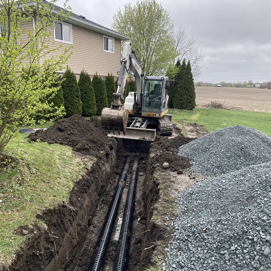 Excavator removing failed septic bed in Puslinch