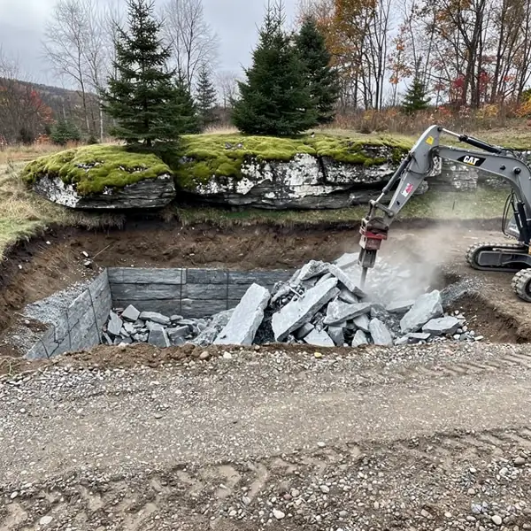 Hydraulic hammer breaking rock near Campbellville
