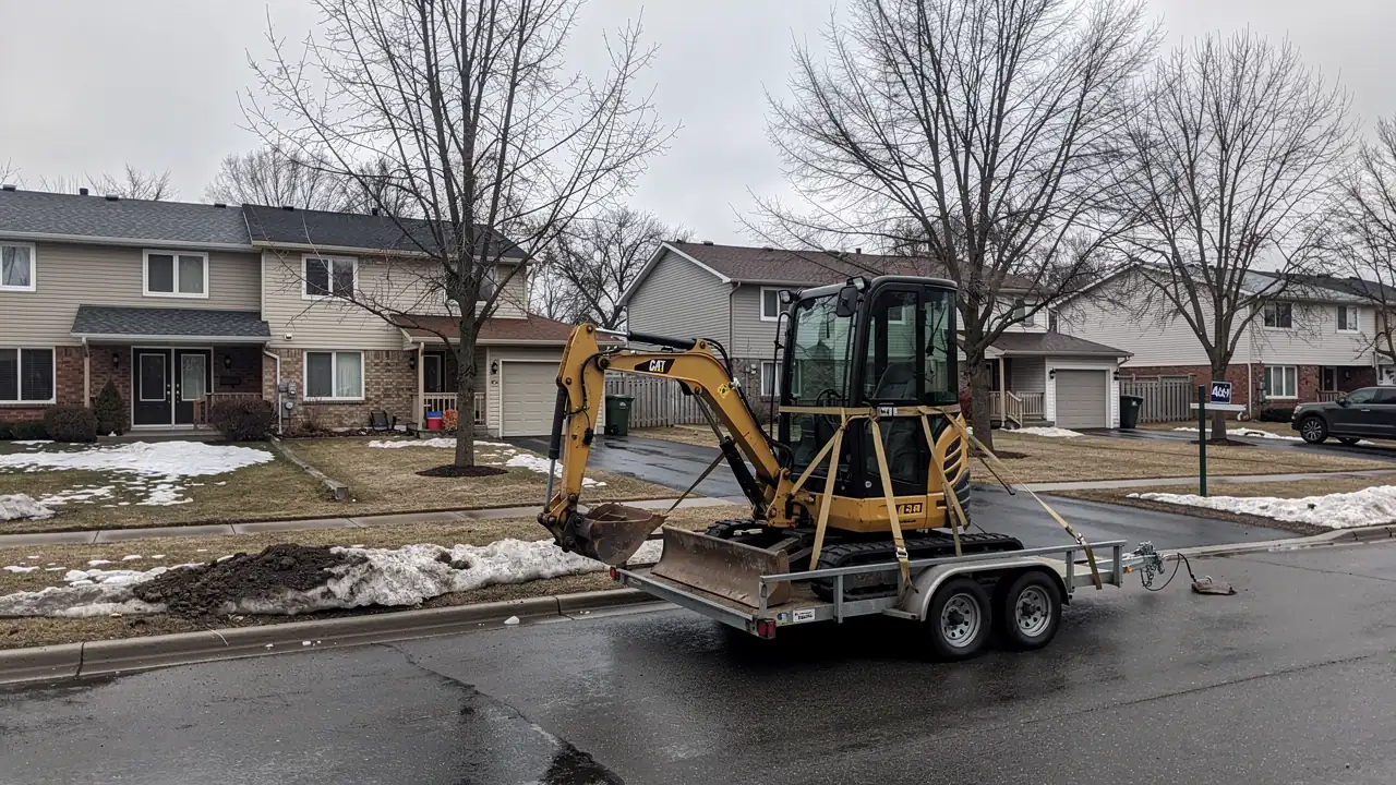 Mini excavator on trailer in Guelph Mini excavator on trailer in Guelph