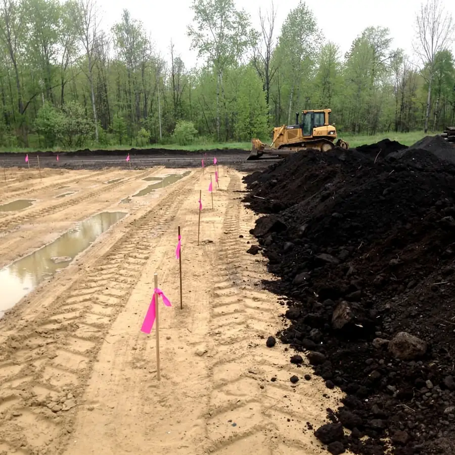 Topsoil stripped and stockpiled on building lot