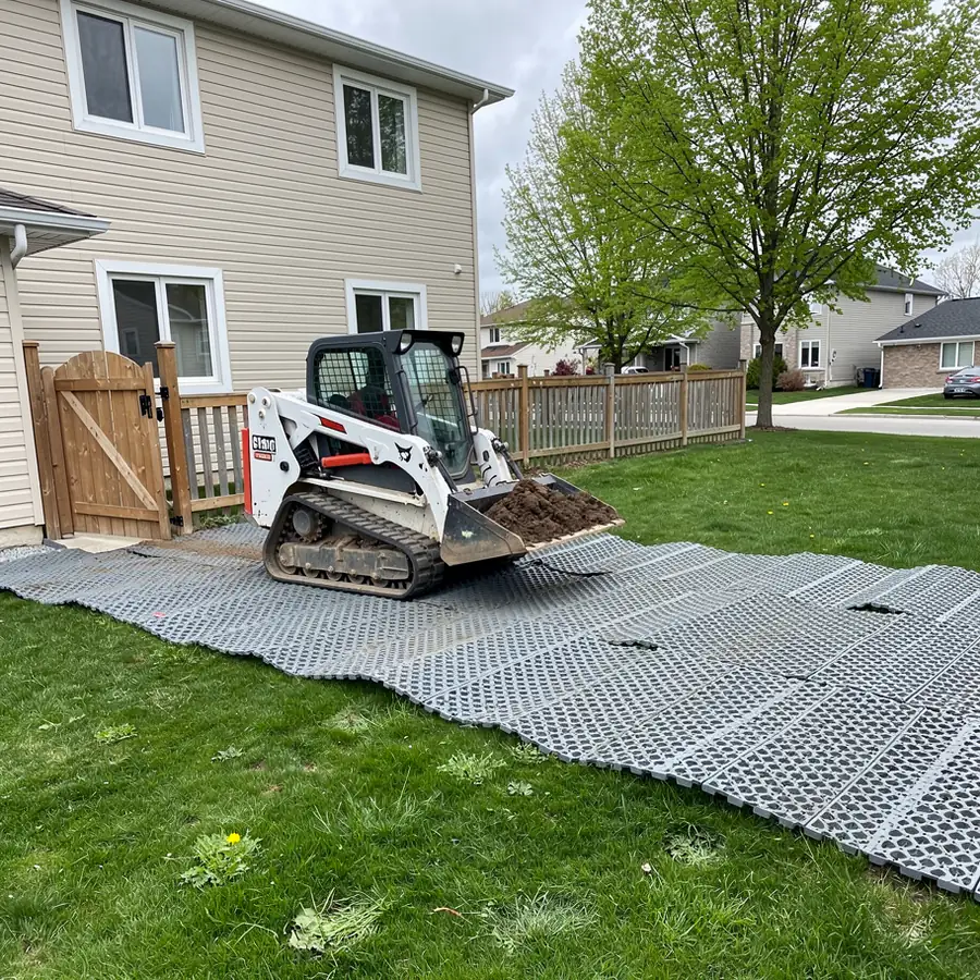 Track loader on ground mats in Guelph